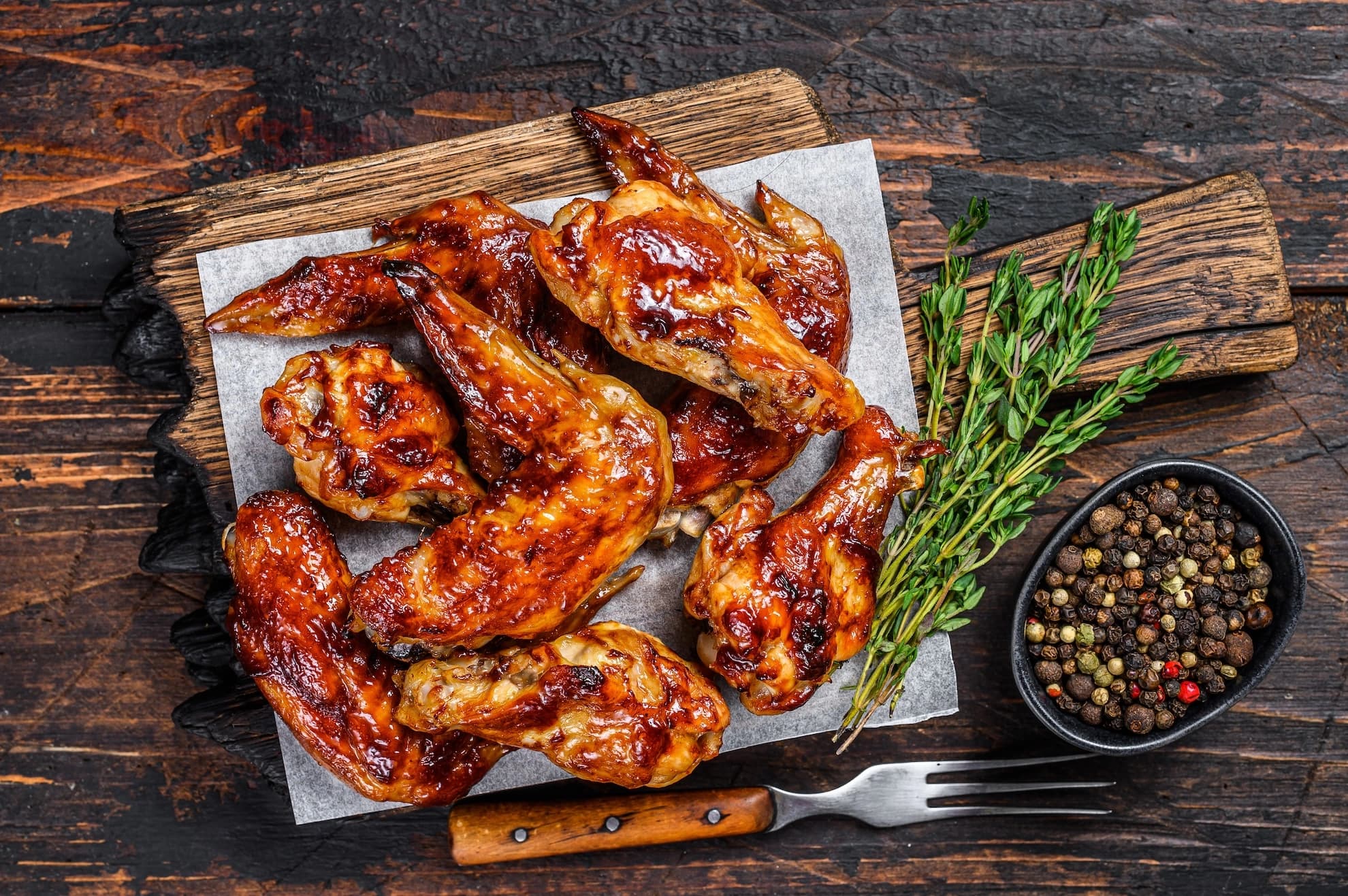 Baked barbecue chicken wings served with dipping sauce